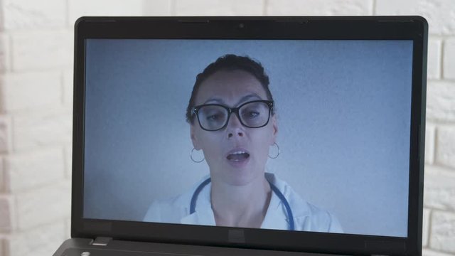 Bad Internet connection. Online doctor consultation. Doctor at the laptop screen. Bad Internet.