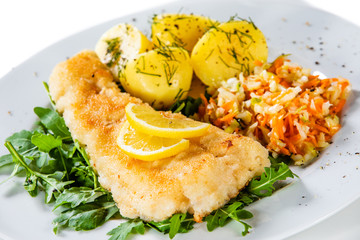 Fish dish - fried fish fillet boiled potatoes and vegetables