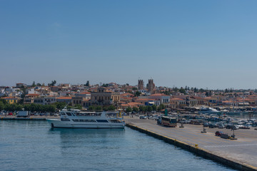 Fototapeta na wymiar Port of Aegina town with yachts and fishermen boats docked in Aegina island, Saronic gulf, Greece, at sunrise.