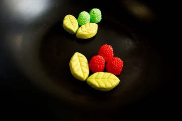 Fruit candy on black. Delicious fruit candy. Multicolored fruit candy. - 282927804