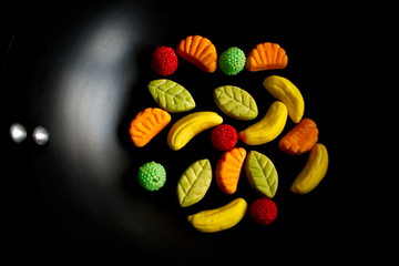 Fruit candy on black. Delicious fruit candy. Multicolored fruit candy. - 282927830