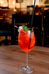 red alcoholic cocktail with fruits