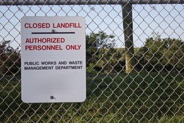 Closed Landfill sign on chain link fence