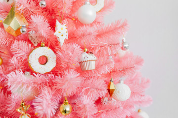 Pink Christmas tree and christmas decorations white and gold color.  Christmas background. Happy New Year and Xmas Christmas concept. .