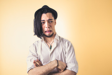 Obraz premium Man looks disgusted when he sees something very unpleasant.