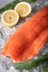 raw salmon fillet on gray background