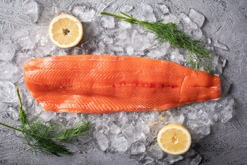 raw salmon fillet on gray background