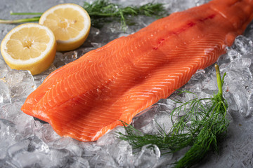 raw salmon fillet on gray background