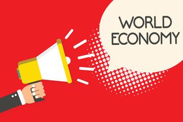 Text sign showing World Economy. Conceptual photo Global Worldwide International markets trade money exchange Man holding megaphone loudspeaker speech bubble red background halftone