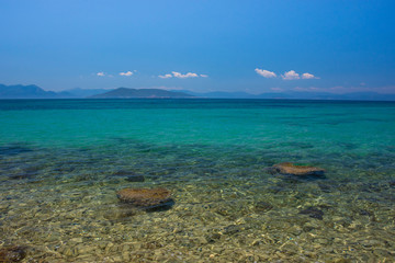 Obraz premium The clear and blue waters of Mediterranean sea in the Saronic gulf, Greece.