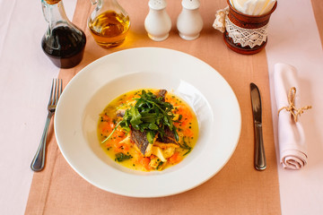 Chilean Sea Bass on a Polenta Blanket with Fresh Mushrooms and Broth