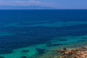 Plakat The clear and blue waters of Mediterranean sea in the Saronic gulf, Greece.