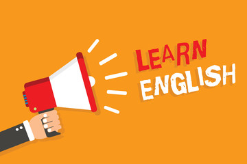 Conceptual hand writing showing Learn English. Business photo showcasing Universal Language Easy Communication and Understand Man holding megaphone orange background message speaking