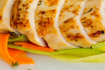 Delicious cut grilled meat on white background, top view macro