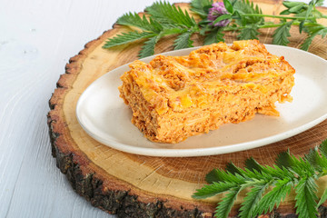 Meat lasagna on a white wood background. toning. selective focus