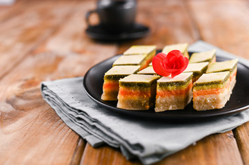 Oriental sweets with different tastes on a wooden background. Traditional dessert and coffee. Tasty national sweets. Copy space.