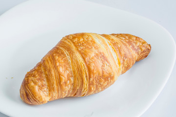 Plain croissant on white background