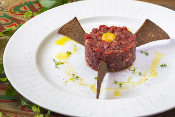 Tuna Yukke The chopped fresh tuna fish with spicy source/sesame oil and it would be served with raw egg on top of it. Side view