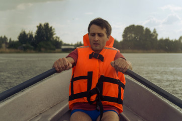 Man paddling hard during a summer thunderstorm