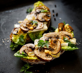 Mushroom sandwich, open faced sandwich with addition of brown sliced mushrooms, camembert cheese,...
