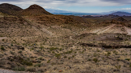 landscape view of mountains and mountain bikers