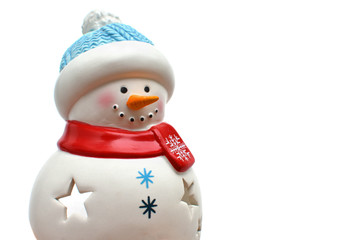 The figure of a ceramic snowman on an isolated white background. Christmas home decor, candle holder. Part of the image. Place for text