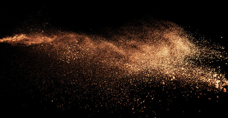 a shot from a firearm, an explosion of gunpowder on a black background, a bright flash with flying...