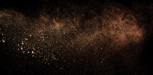 a shot from a firearm, an explosion of gunpowder on a black background, a bright flash with flying...