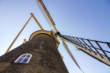 Leiden, Holland, Netherlands, April 21, 2019. CLose-up view of sail axle and vanes of cap loft and...
