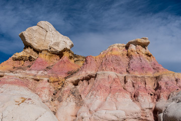 Landscape of yellow, pink and white rock formations at Interpretive Paint Mines in Colorado