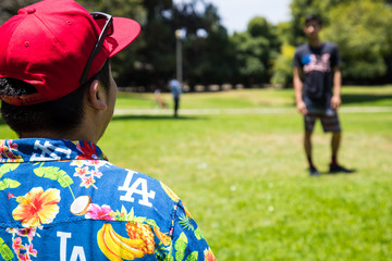 boy playing with ball in park