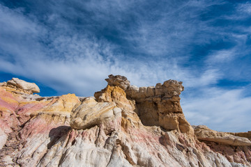 Landscape of white, pink and yellow hoodoos and rock formations at Interpretive Paint Mines in Colorado