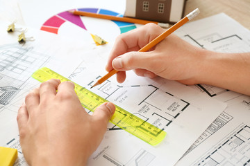 Architect working on project of building in office, closeup