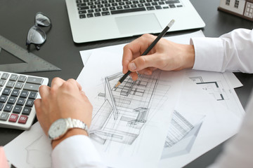 Architect working on project of building in office