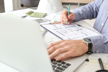 Architect working on project of building in office