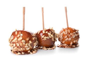 Tasty candy apples on white background