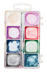 used palette of watercolor paints isolated on white background. art school concept. Colorful Messy Used Half Pan Paints