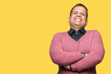 Middle age arab man over isolated background happy face smiling with crossed arms looking at the camera. Positive person.