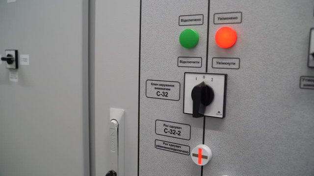 Dashboard with buttons and switches on a solar power station. Panel inscription: Enable, disable, C-31, C-32 switch control key, C-31-3, C-32-2 disconnector, disconnector On and Off