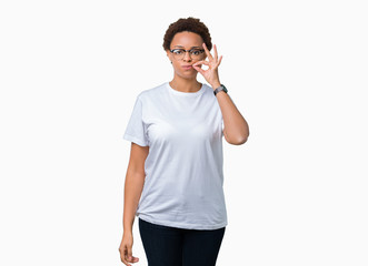 Beautiful young african american woman wearing glasses over isolated background mouth and lips shut...