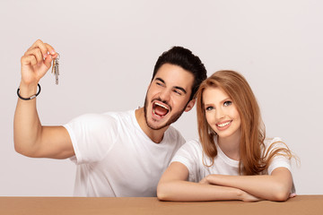 Fototapeta premium Happy couple with keys to new home.