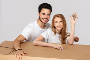Happy couple with keys to new home.