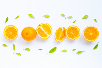High vitamin C, Juicy and sweet. Fresh orange fruit with green leaves  on white.