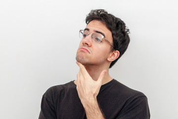 pensive young man on white background