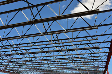 Fototapeta premium Steel framework of new commercial building under construction.