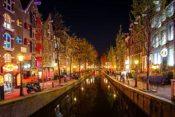 Fototapeta na wymiar Red light district in Amsterdam, Netherlands at night. Nightlife in in Amsterdam, Netherlands
