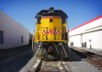 Train on tracks in industrial area