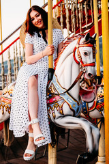 Young adult student girl in the amusement park