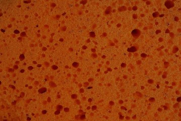 red plastic texture from a piece of foam rubber