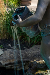 fountain statue of boy pouring water 